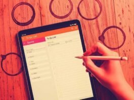 Boost Your Productivity: Must-Have Tech Gadgets for a Supercharged Day A hand scribbling a to-do list on a tablet, surrounded by coffee rings.