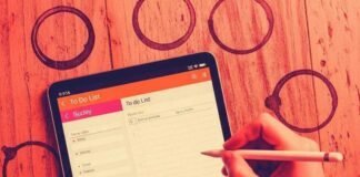 Boost Your Productivity: Must-Have Tech Gadgets for a Supercharged Day A hand scribbling a to-do list on a tablet, surrounded by coffee rings.