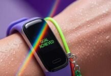 How Wearable Gadgets Are Revolutionizing Fitness A close-up of a sweaty wrist with a fitness tracker showing a rainbow.