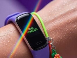 How Wearable Gadgets Are Revolutionizing Fitness A close-up of a sweaty wrist with a fitness tracker showing a rainbow.